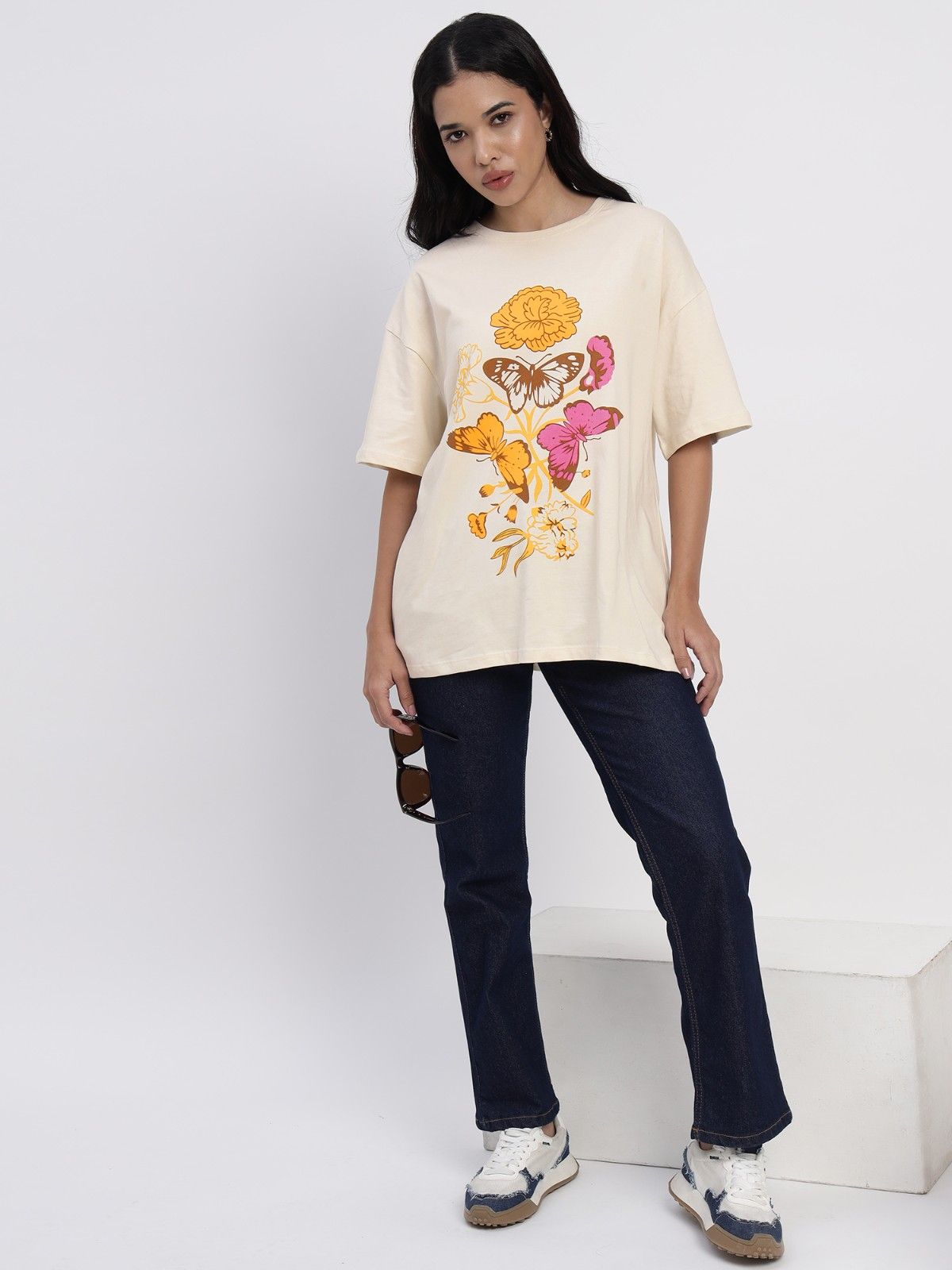 Ivory colored tshirt featuring a beautiful floral inspired print
