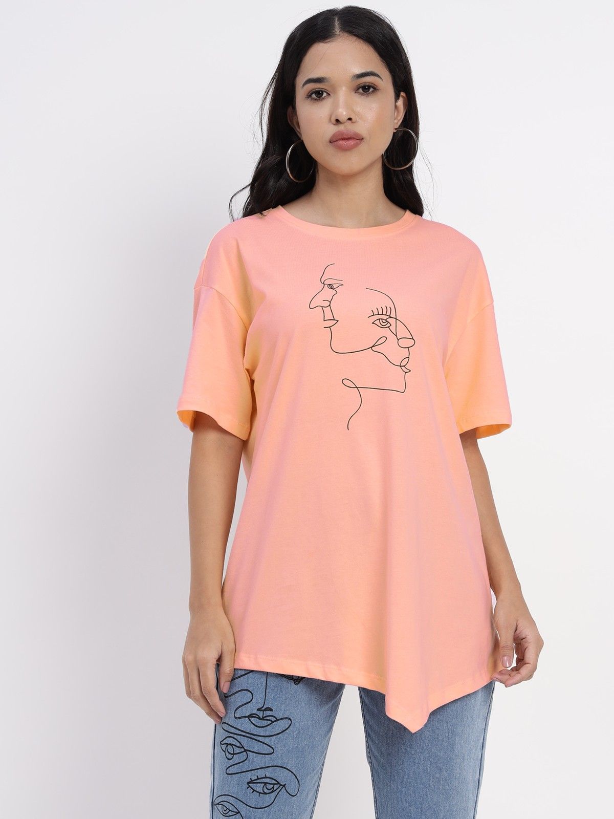 Peach colored tshirt featuring an abstract face sprint