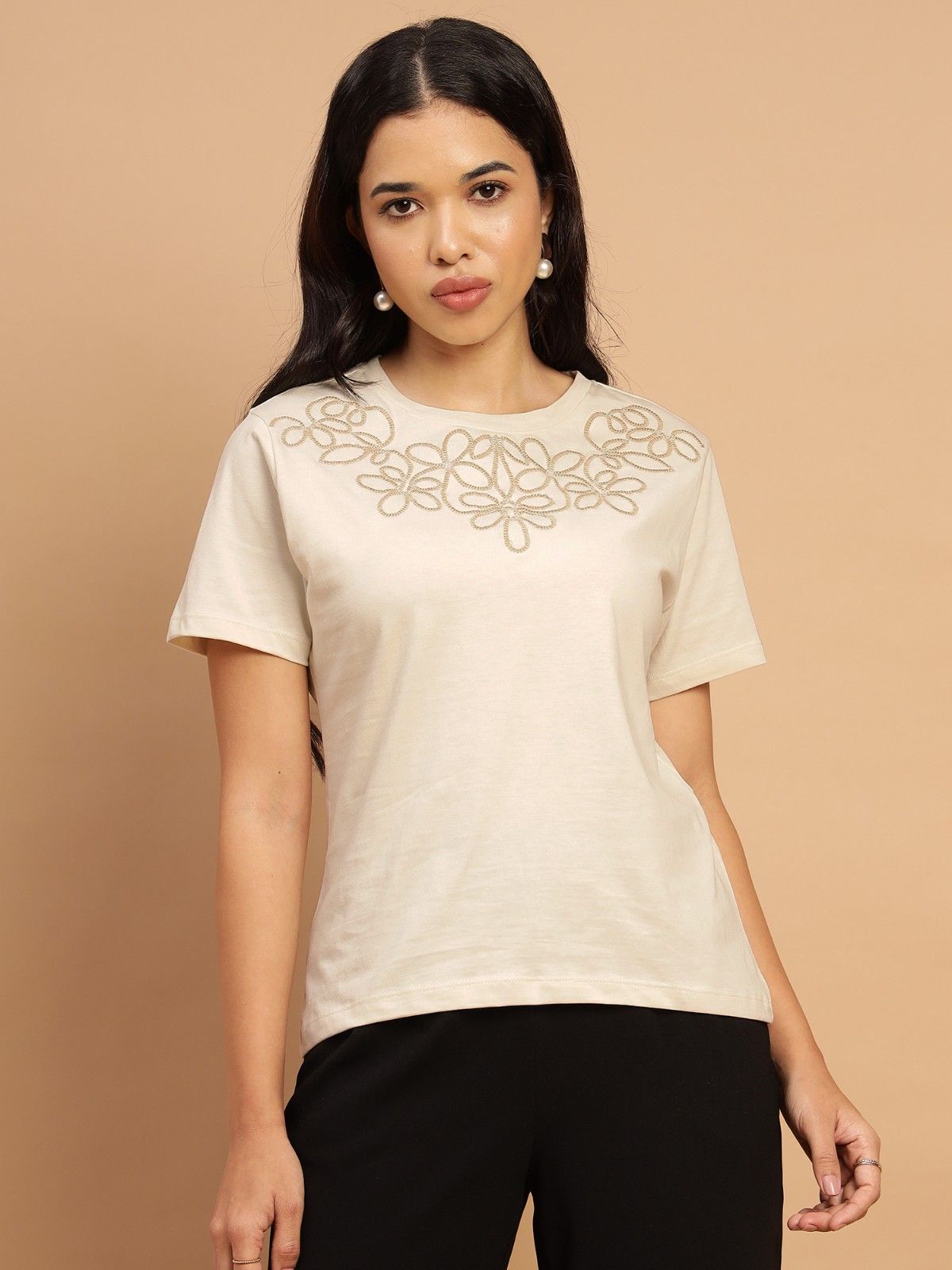 Beige t shirt with a beautiful floral pattern